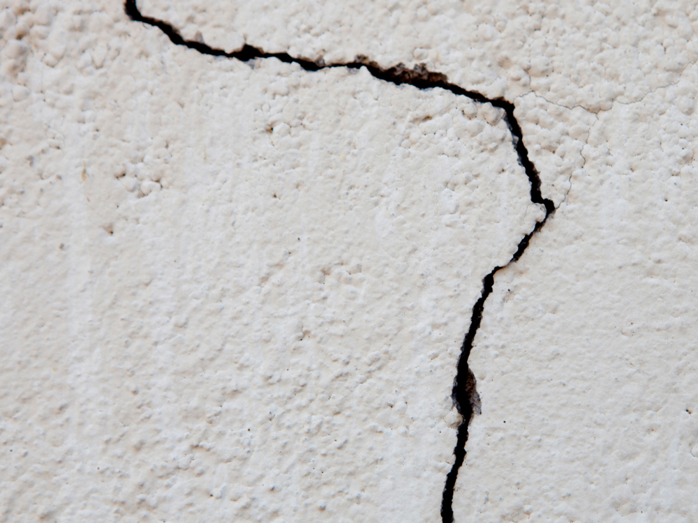 Cracked exterior walls that need to be repaired